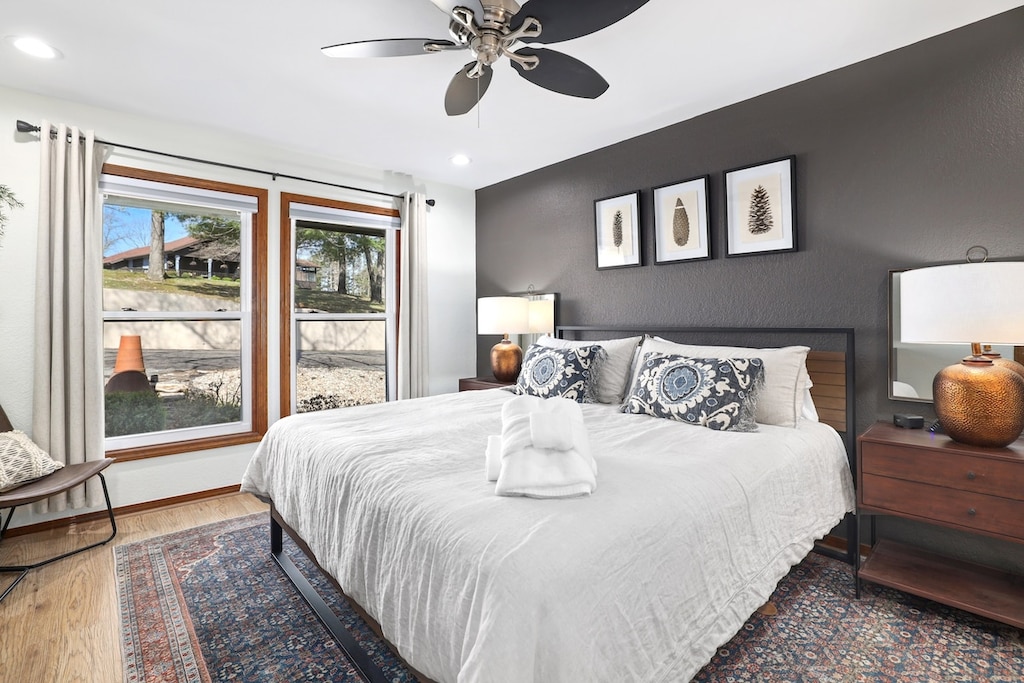 Our Master bedroom features a King-size bed, huge closet, dresser, 55-inch Hisense Android Smart TV, desk area and large en suite bath.