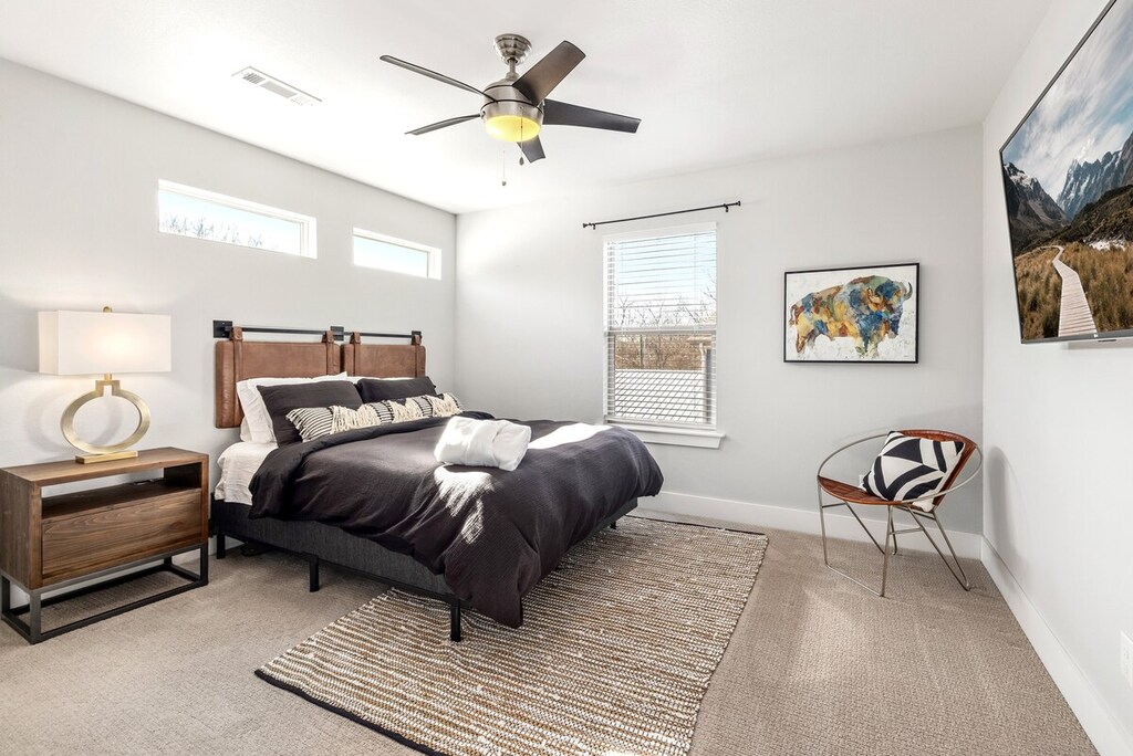 Our Queen bedroom has a large closet, LG Smart TV and a nearby bath.