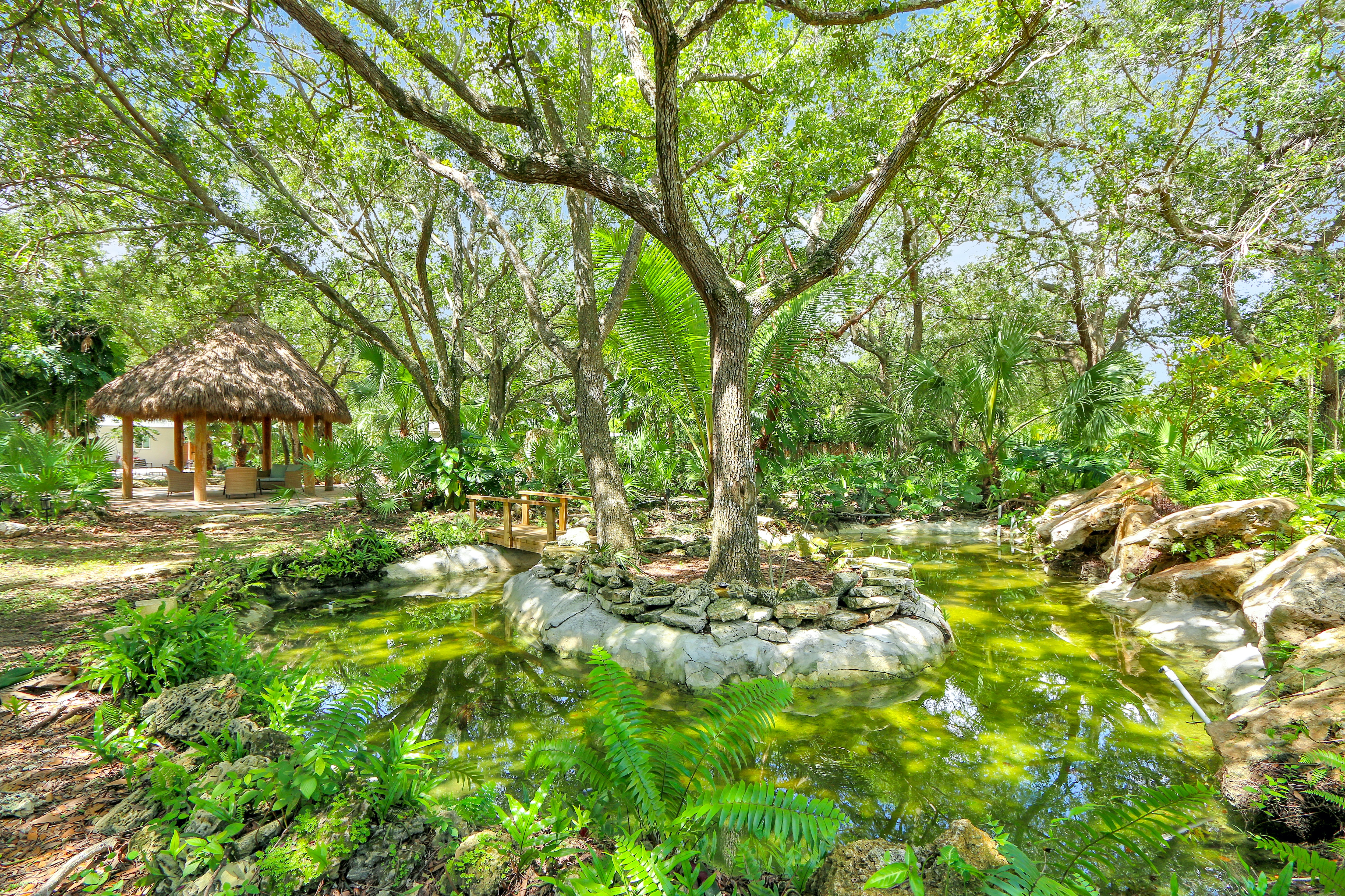 Koi Fish Pond | charming bridge perfect for a leisurely stroll over the water