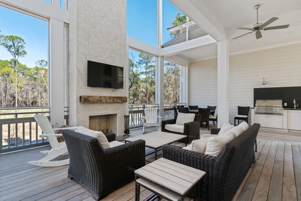 Luxurious Back Porch with Fireplace, Grill Station and Plenty of Seating Luxurious Back Porch with Fireplace, Grill Station and Plenty of Seating
