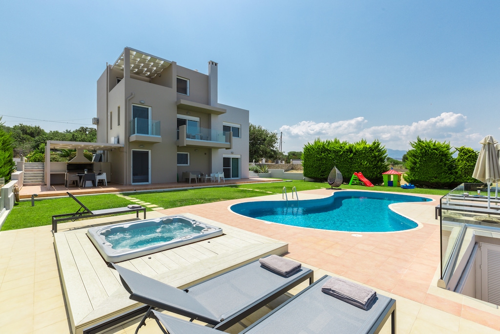 The pool terrace is equipped with sun beds and umbrellas