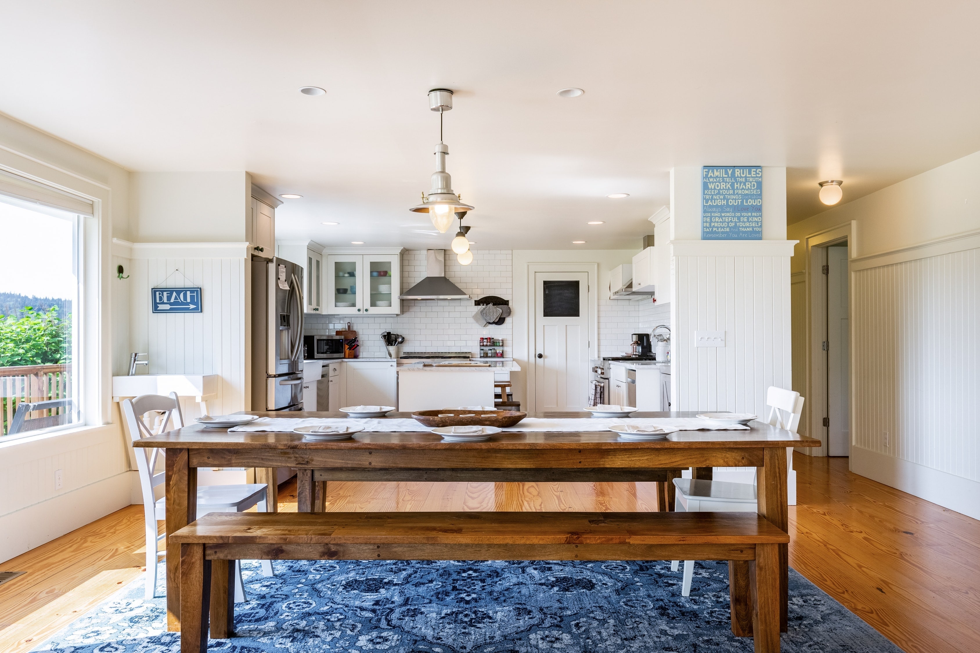 Where the charm of a bright kitchen meets the warmth of wood dining.