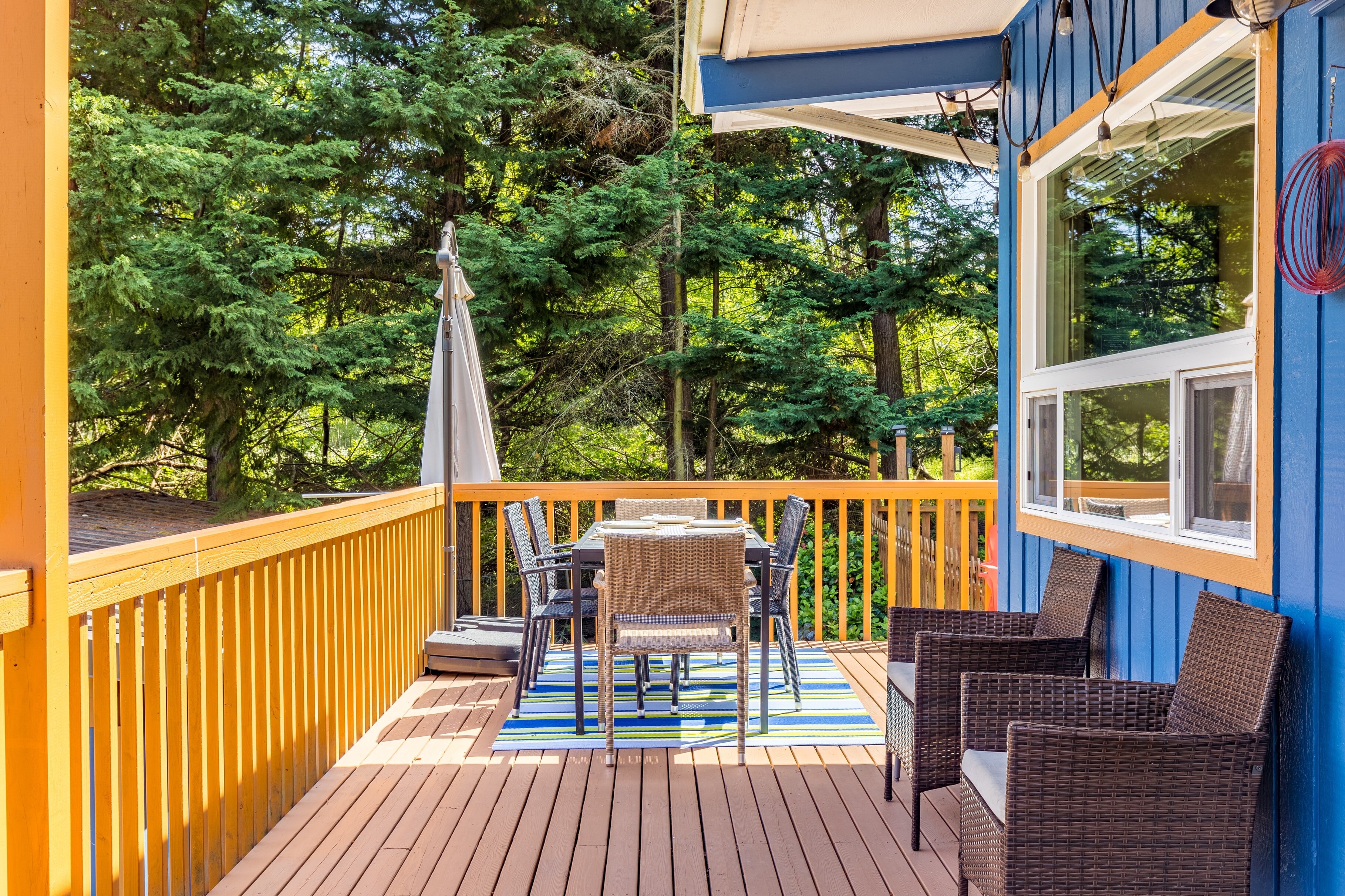 Bathed in the warm, golden glow of the setting sun, the deck provides an unforgettable dining experience.