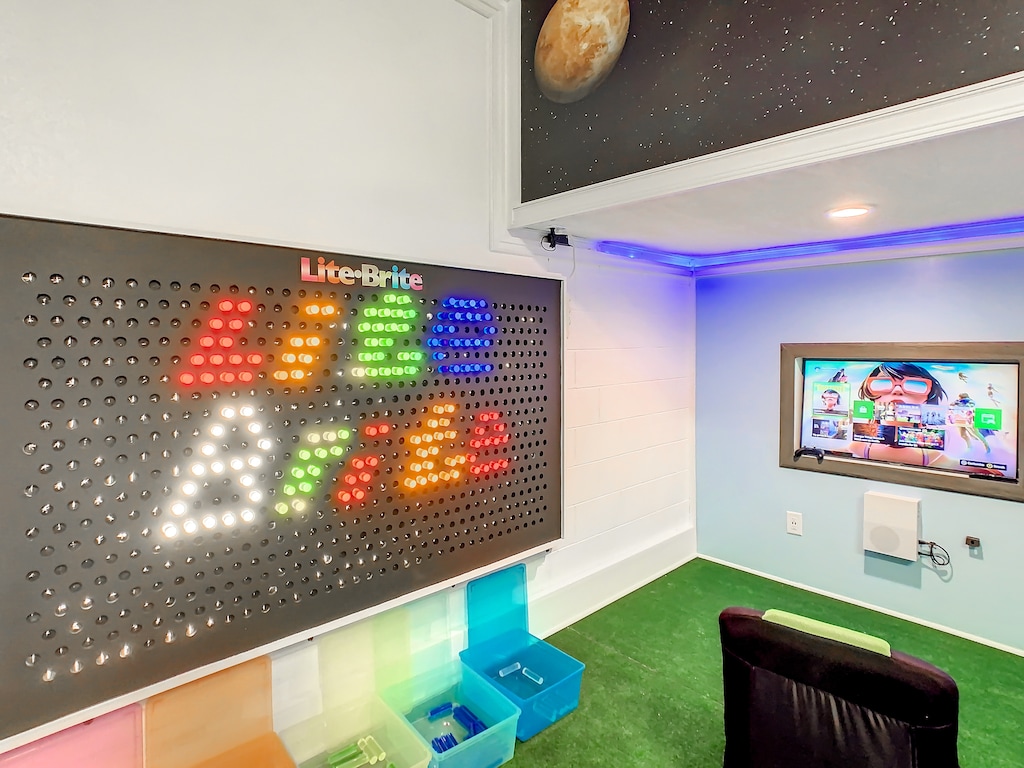 Super Mario game room with a life-size Lite Brite wall