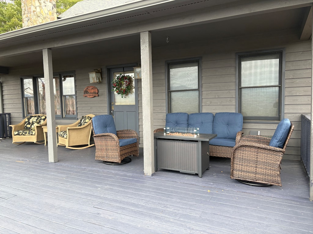 Relax on your spacious covered deck with comfortable seating and a cozy fire table for evening gatherings.