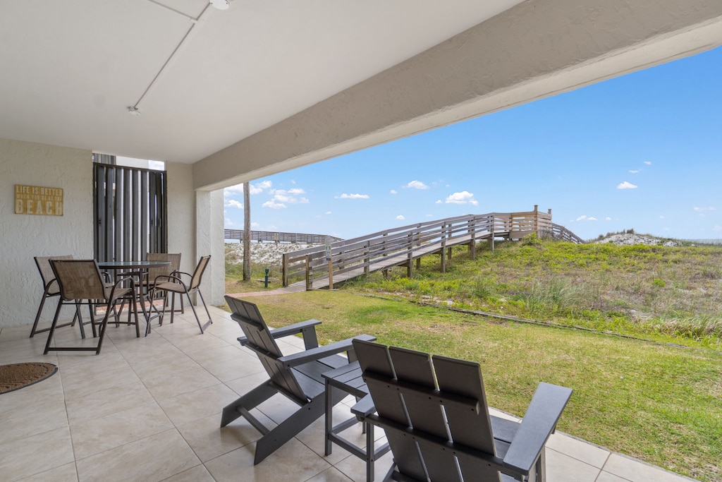 Private ground floor patio with beach access and views