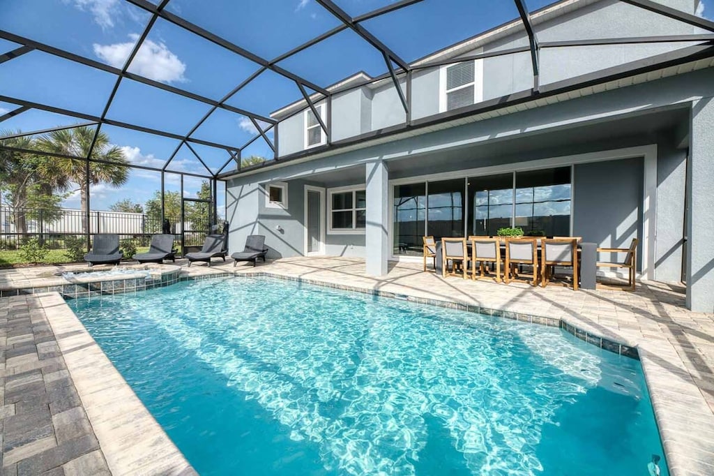 Relax by your private pool oasis with ample seating and a serene atmosphere, perfect for unwinding under the sun.