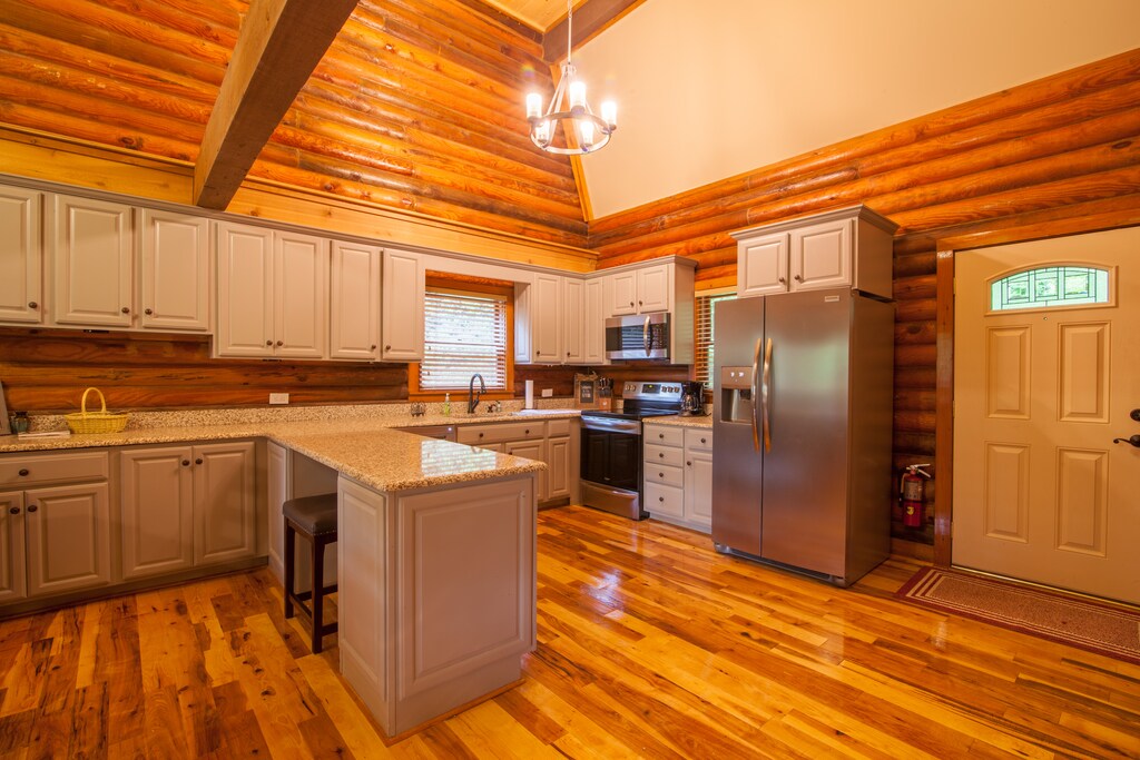 Open Kitchen on Main Level with Granite Counters and Custom Cabinetry