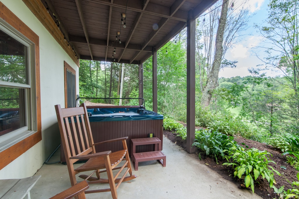 Courtyard off of Lower Level with Hot Tub and Rocking Chairs