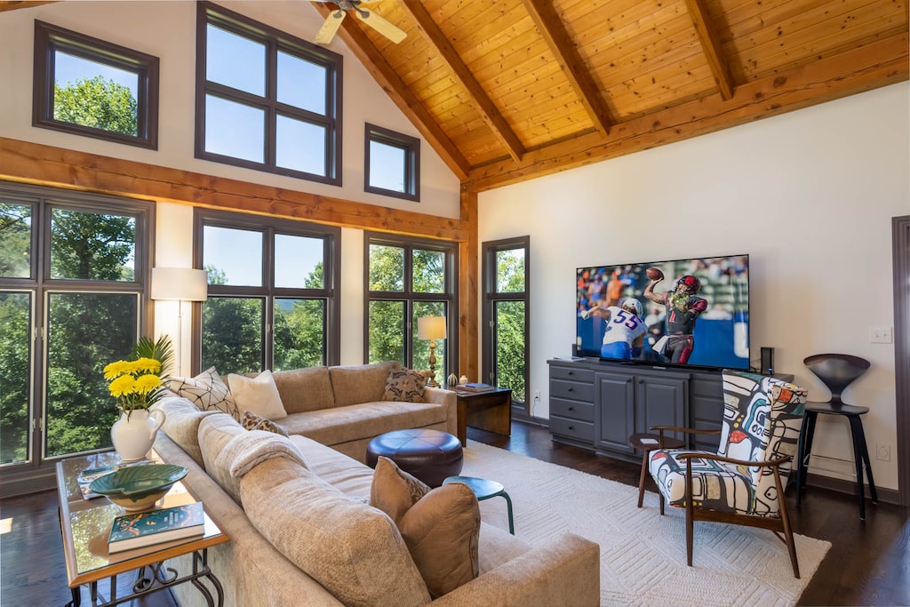 Living room with Vaulted Ceiling and Windows