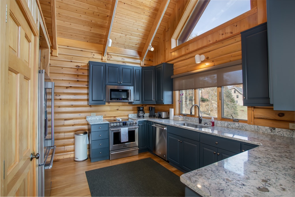 Main Floor Kitchen With Granite and Stainless Appliances