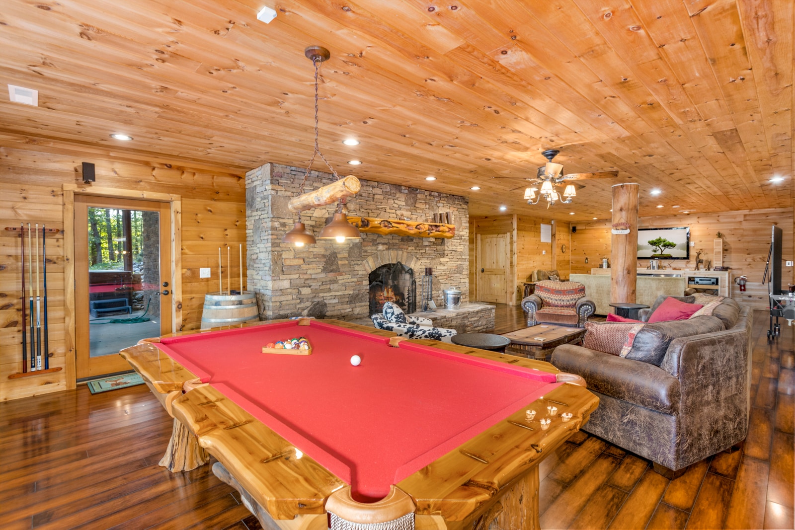 Downstairs Game and Entertainment Room with Wood Burning Fireplace
