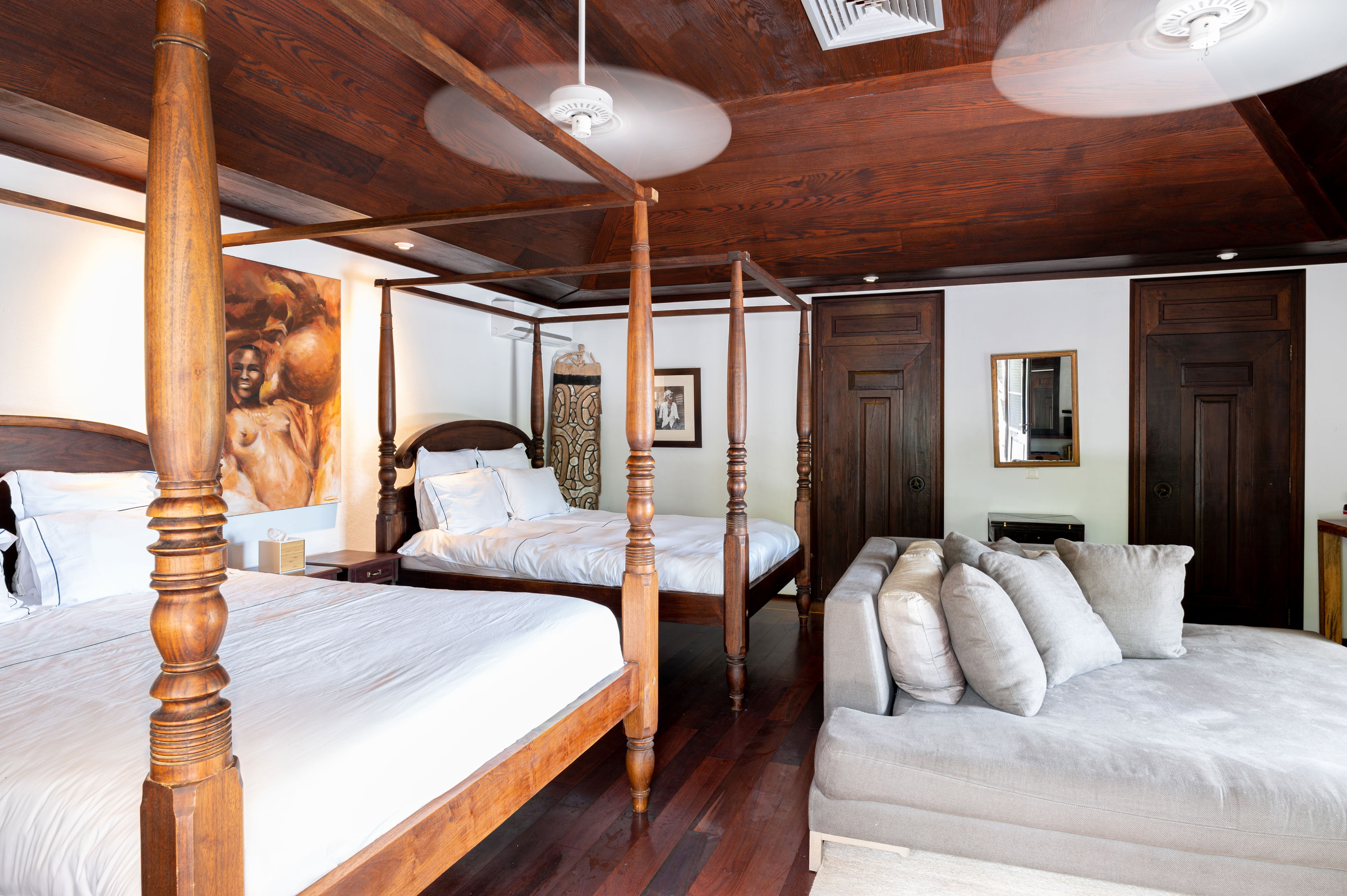 In a separate bungalow.  Large master bedroom with two spectacular canopy king size beds, air conditioning, ceiling fan, HD-TV, Dish Network, living area, mosquito screens, safe. Ensuite bathroom with shower and rain shower, 2 wash basins, hair dryer, tow