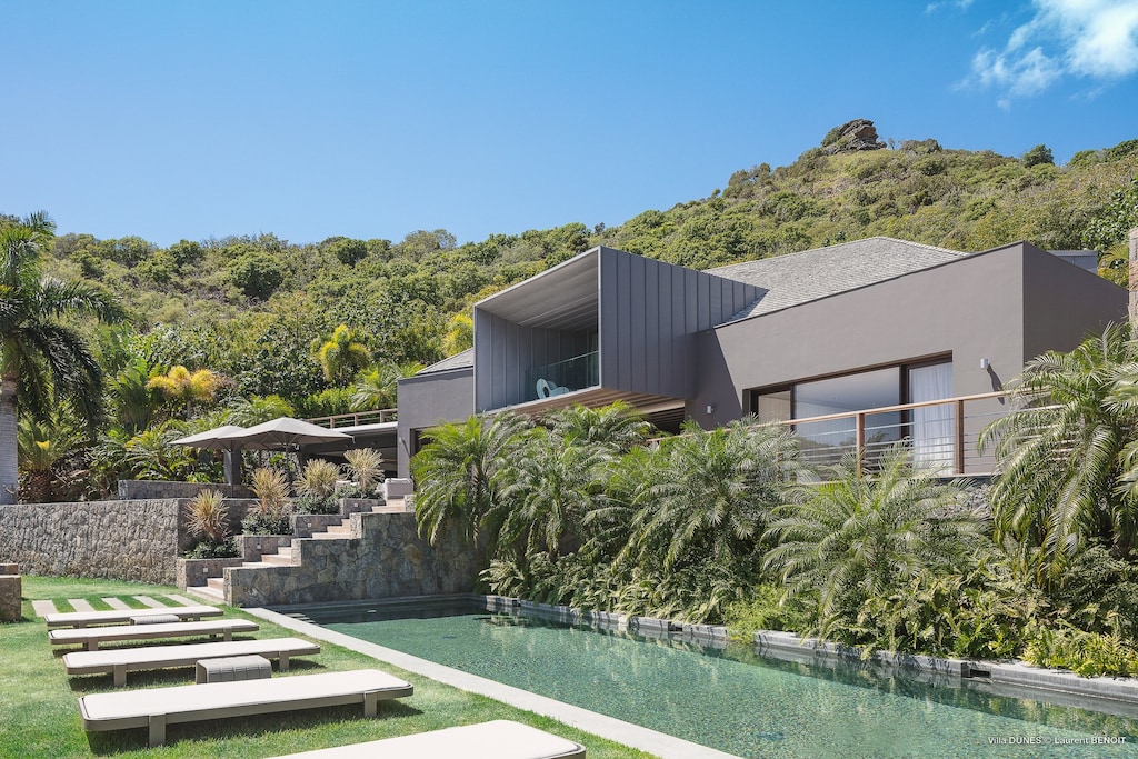 Two heated pools 3 x 18 m and 4 x 8 m, expansive terrace with lounge chairs.