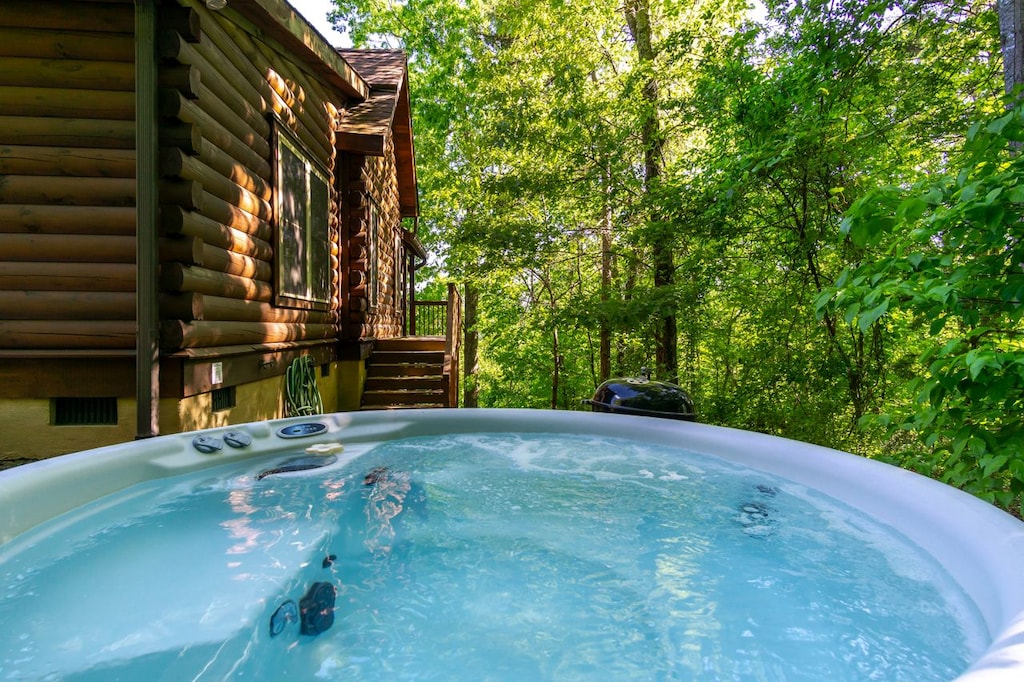 Soak in the private hot tub after a full day of fun outdoor activities.