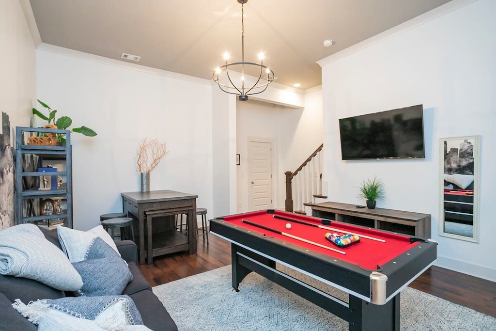 Garage level recreation room w/TV, sleeper sofa, bar, and compact pool table!