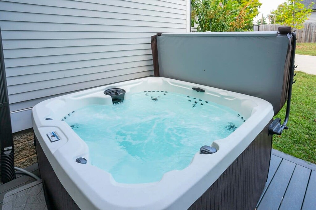 Exterior hot tub under breezeway