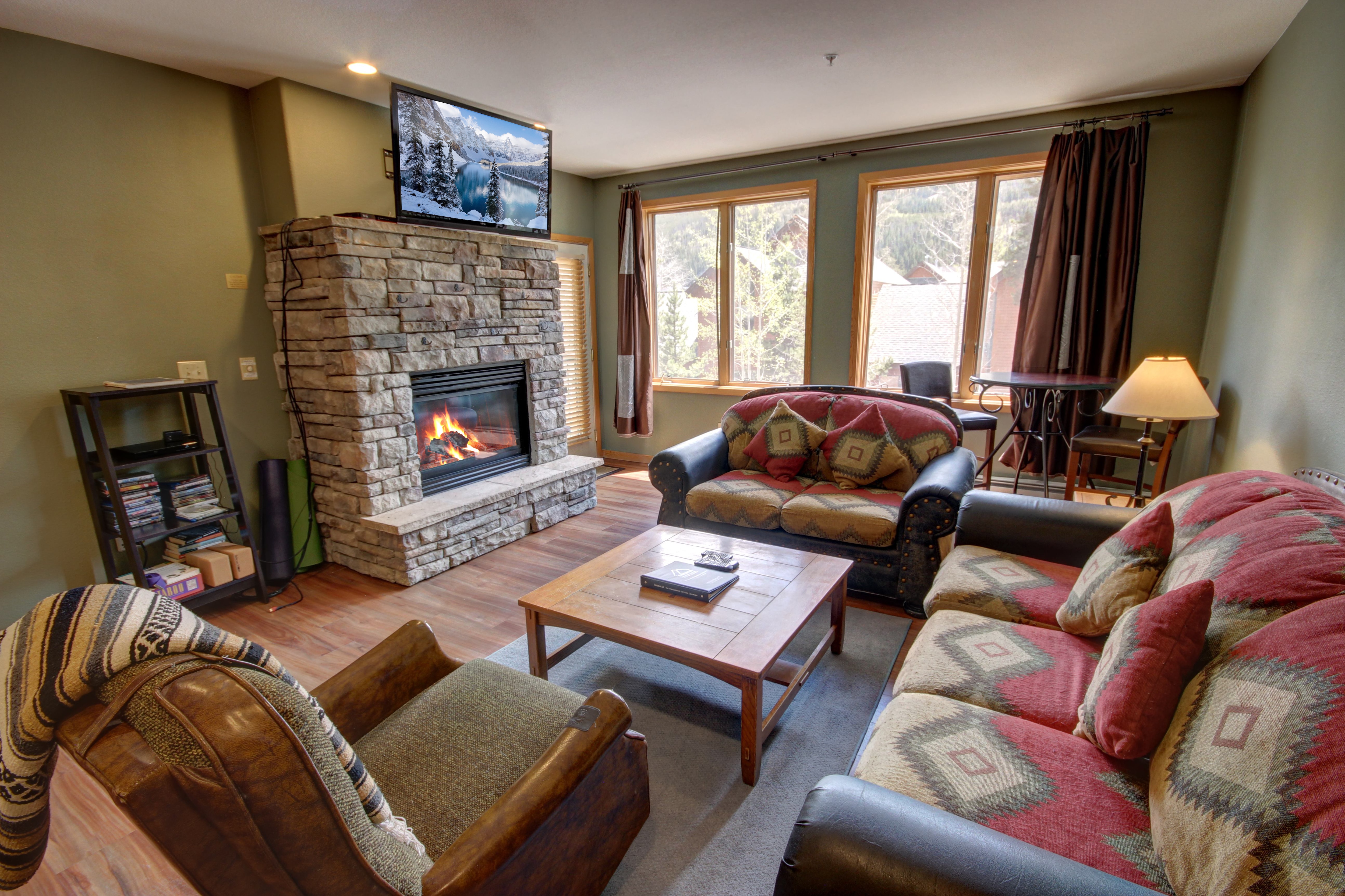 Living room with cozy fireplace and flatscreen TV