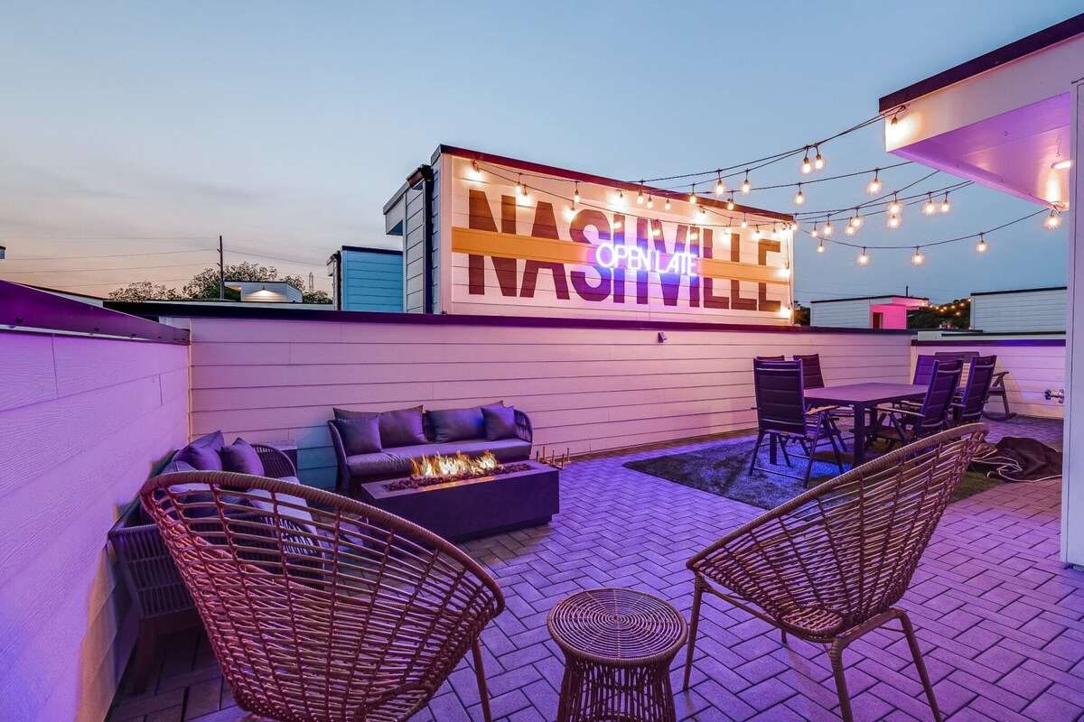 Instagrammable Rooftop Experience: Capture the essence of Nashville on our rooftop deck, featuring a neon light mural wall that reads "OPEN LATE Nashville." With outdoor dining, lounge seating, a fire pit, and downtown views, it's an Instagrammable spot that reflects the city's vibrant nightlife.