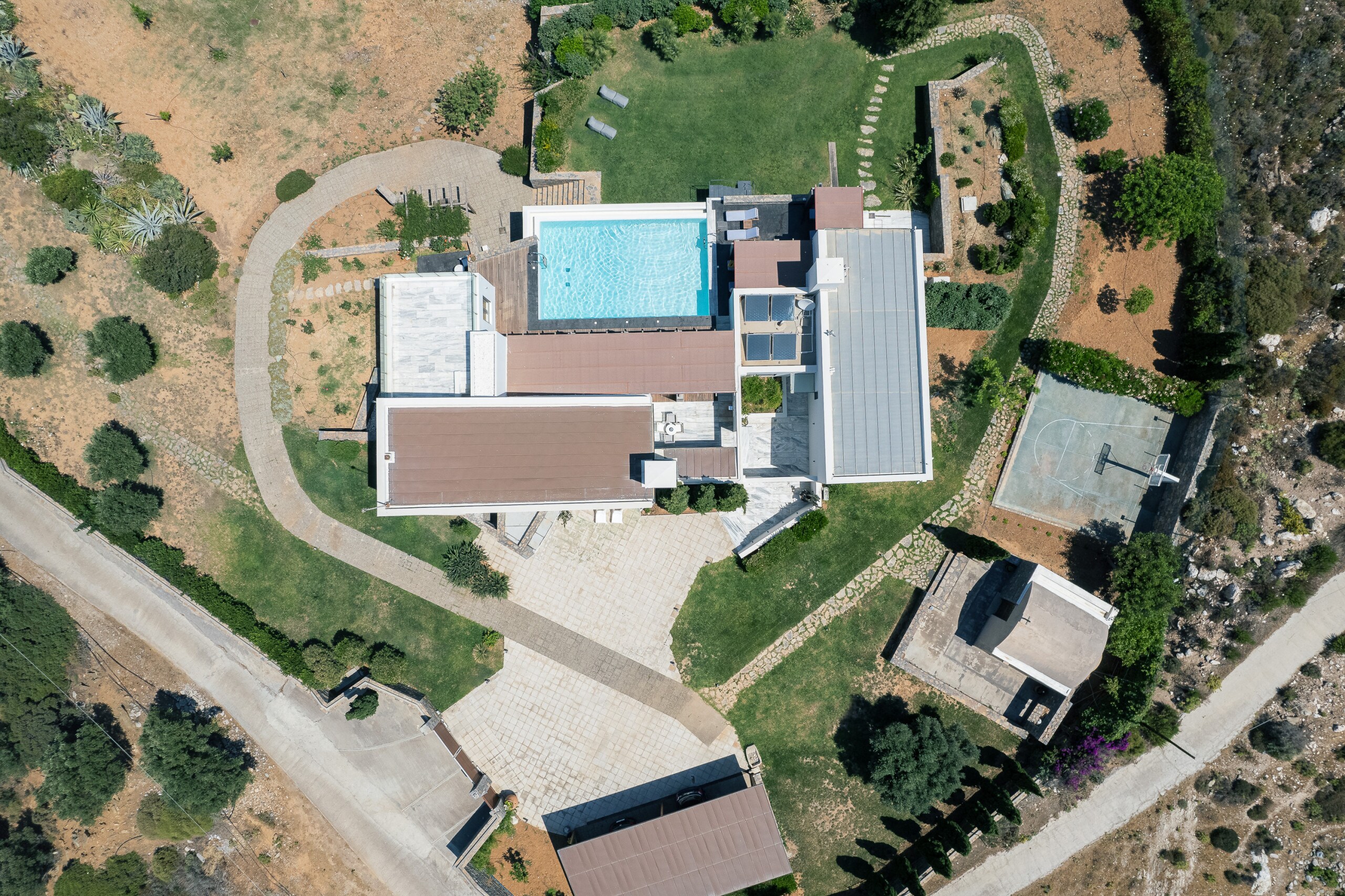 Birds Eye view from the villa outdoor spaces, an iconic holiday home in Agia Pelagia.