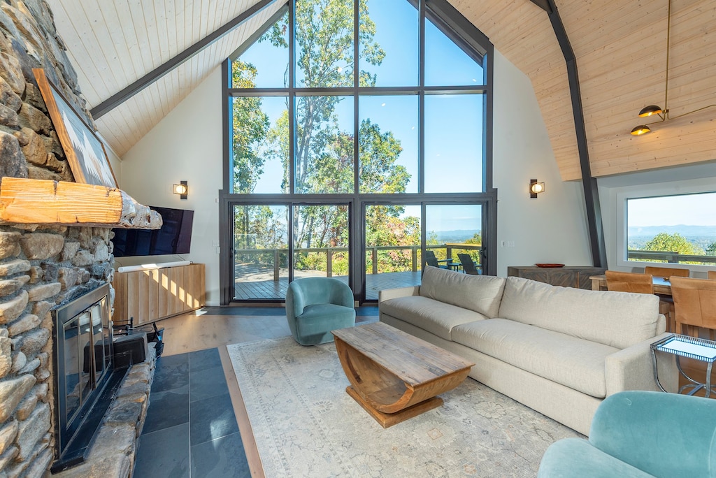 Cozy up in the living room around the wood-burning fireplace as you stream your favorites on the Smart TV and enjoy floor-to-ceiling views.