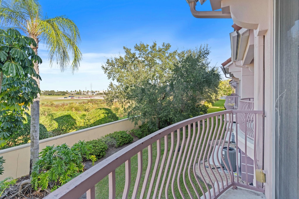 Comfortable living room of the Townhouse at Vista Cay Resort in in Orlando - Welcoming environment with Cozy sofas for relaxation. - Blending modern comfort and decored with aesthetics wall paintings. - Living area with glorious private balcony
