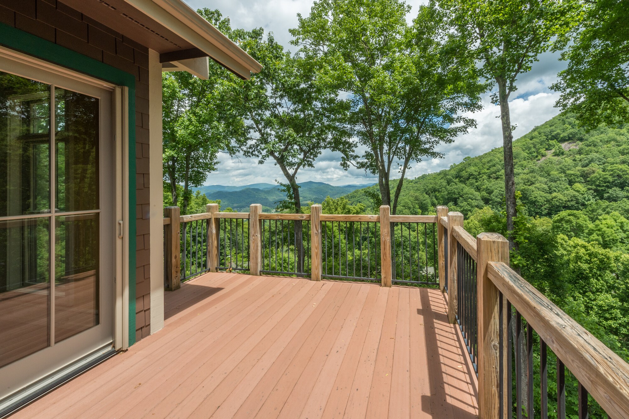 Incredible long-range mountain views! The back deck has a gas grill and now includes a high-top table and 2 chairs.