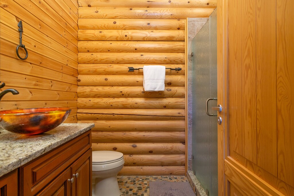 Main level full bathroom with walk-in shower.