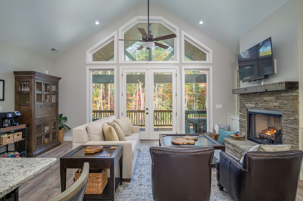 Enjoy floor-to-ceiling views of the woodlands just outside (with deck access) in the living area.