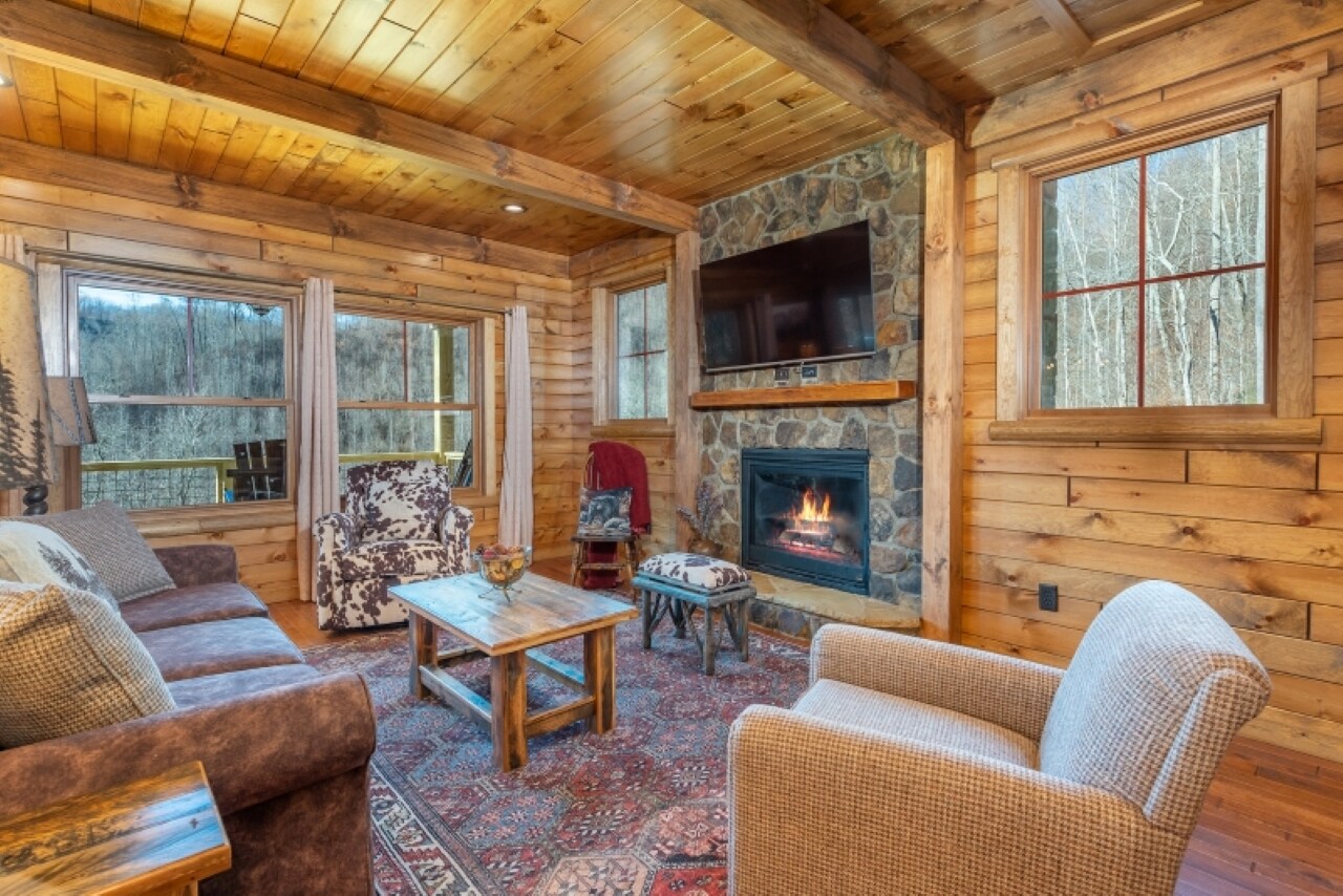 Cozy up around the gas logs fireplace in the living room to watch your favorite shows and movies on the satellite TV.