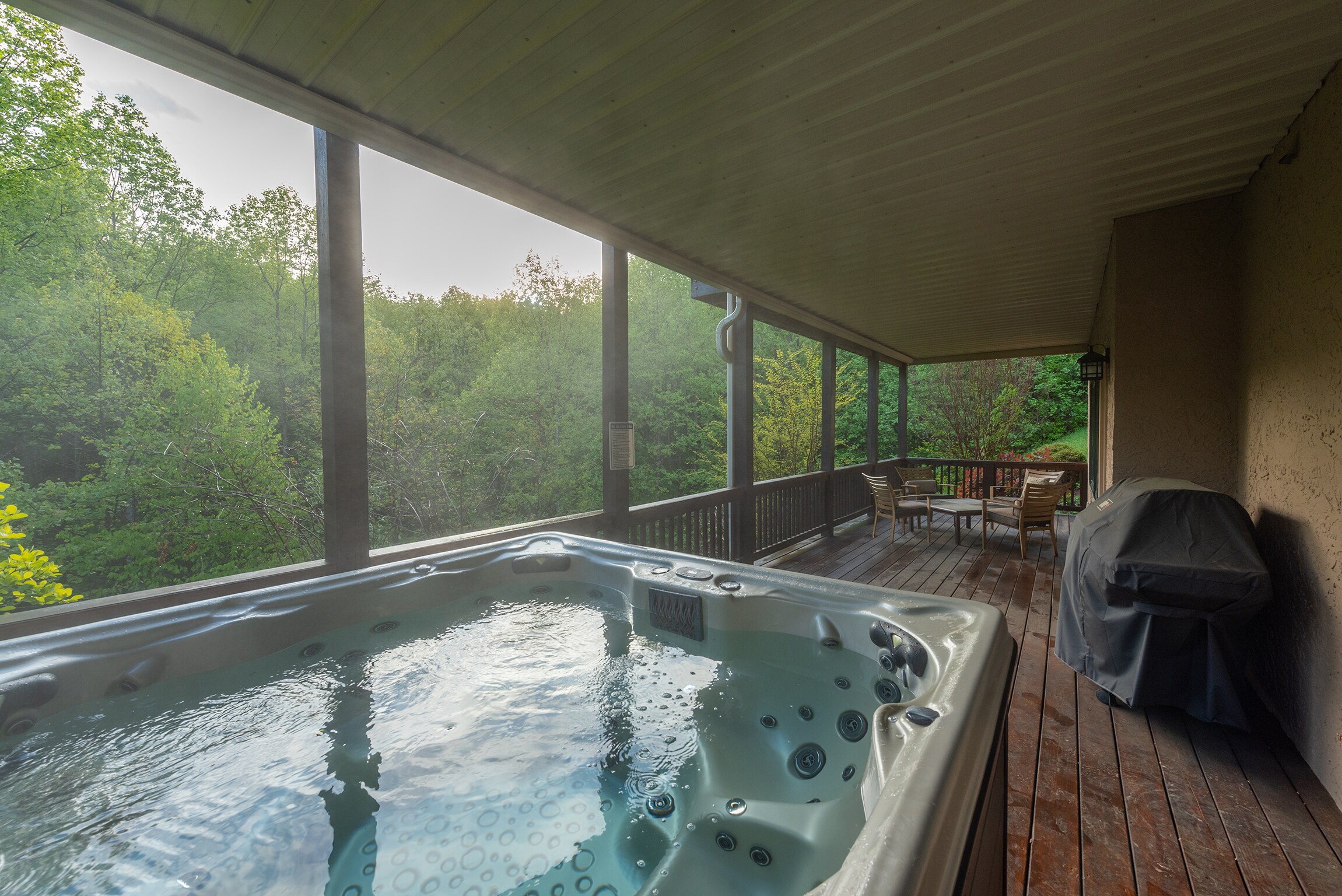 The lower deck offers a gas grill & 8-person hot tub to enjoy.