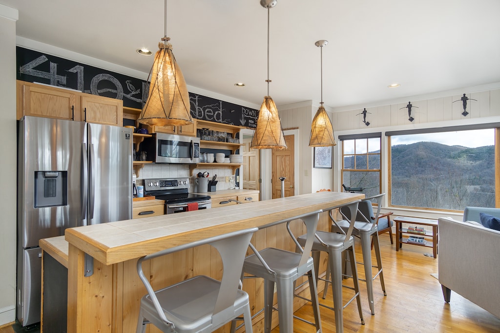 Craft delicious meals in the kitchen complete with island seating for 4, a dishwasher & Drip-style coffeemaker.