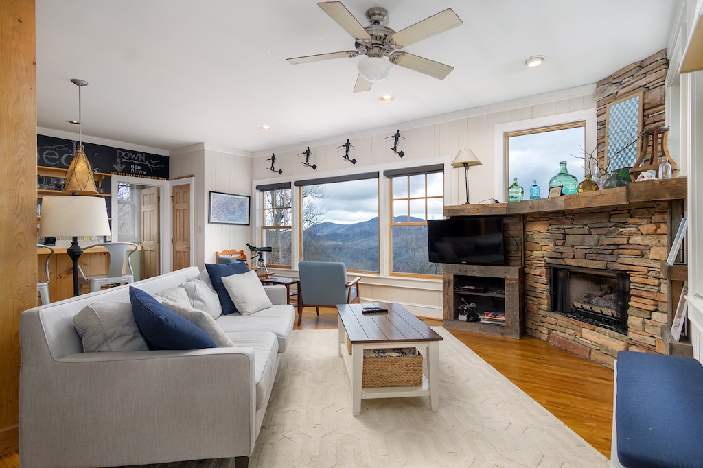 Get cozy in the chic living room around the gas logs fireplace to stream binge-worthy shows on the Smart TV while taking in the mountain views from the window.
