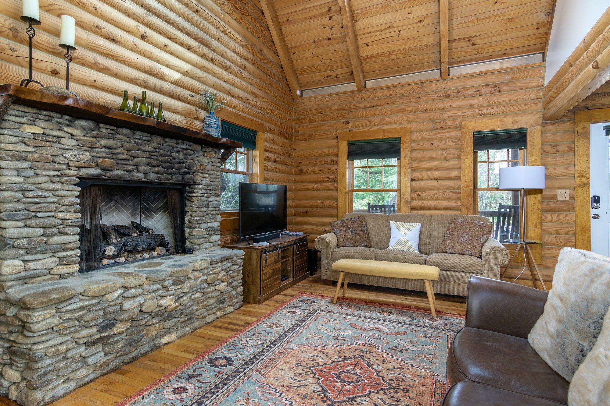 Gather in the cozy living room around the gas logs fireplace while streaming your favorite shows & movies on the 50" smart TV.
