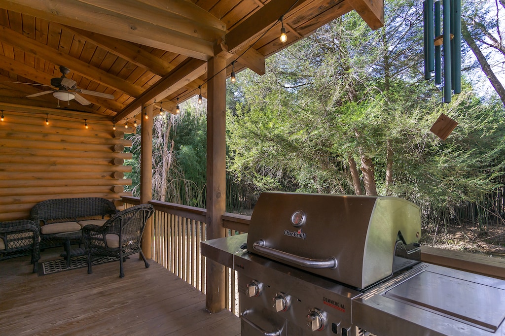 Covered deck with gas grill.
