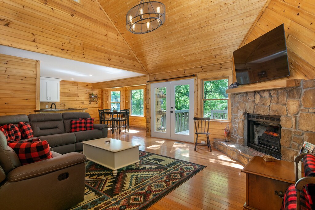 Living room with 65" Roku SmartTV and electric fireplace