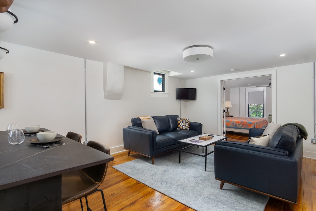Open-concept kitchen and living room with Smart TV for streaming.