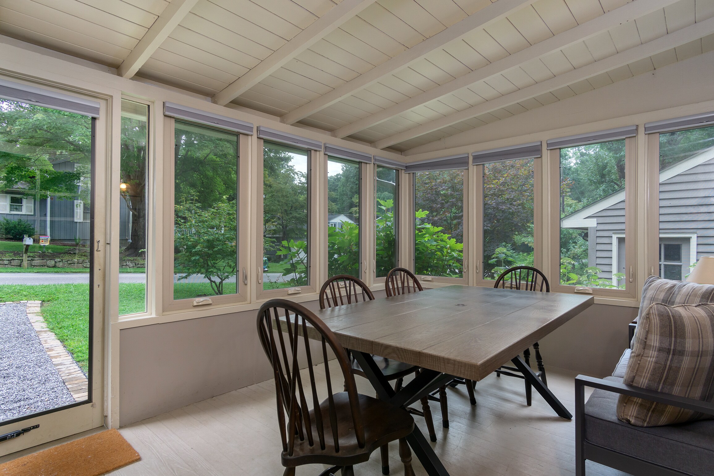 Relax or dine in the three-season room with casement windows.