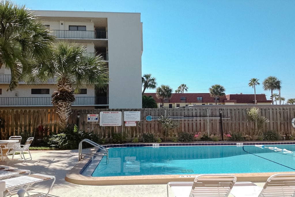 Soak up the sun poolside and enjoy a refreshing swim in this tropical oasis.