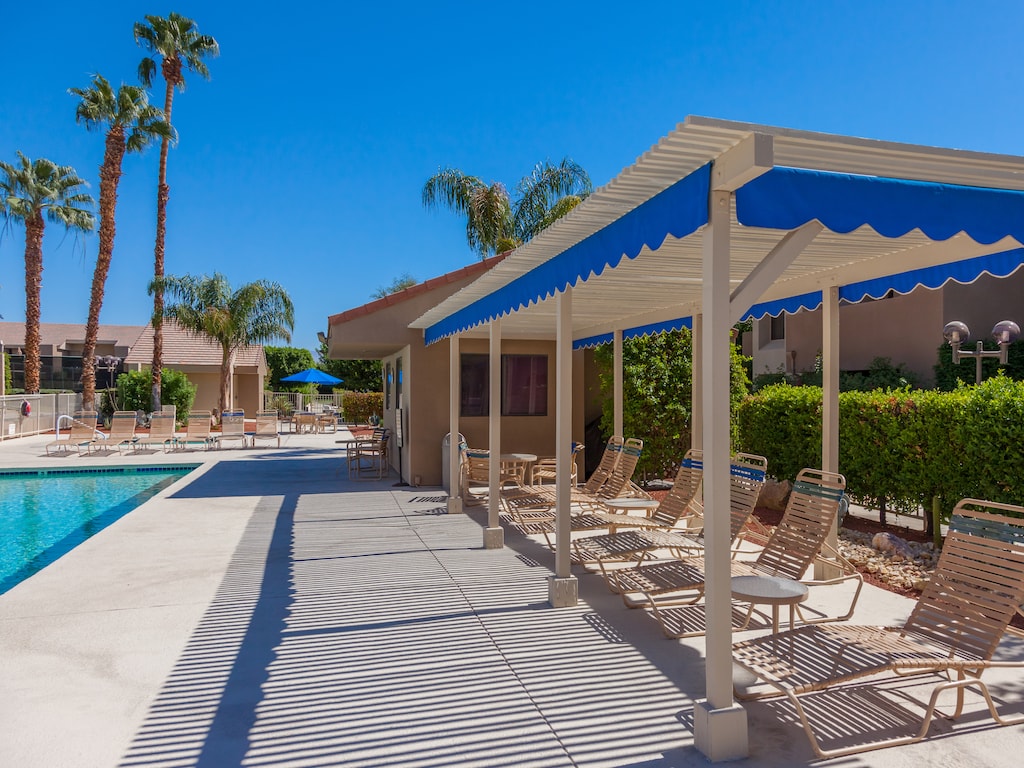 Covered poolside lounge chairs
