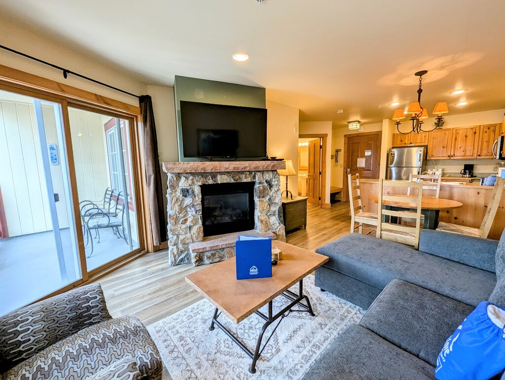 Relax by the gas fireplace on a snowy day in