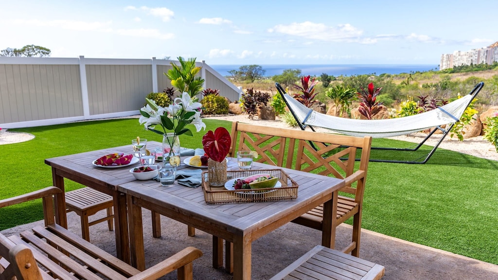 Al fresco dining on the patio as you look toward the water.
