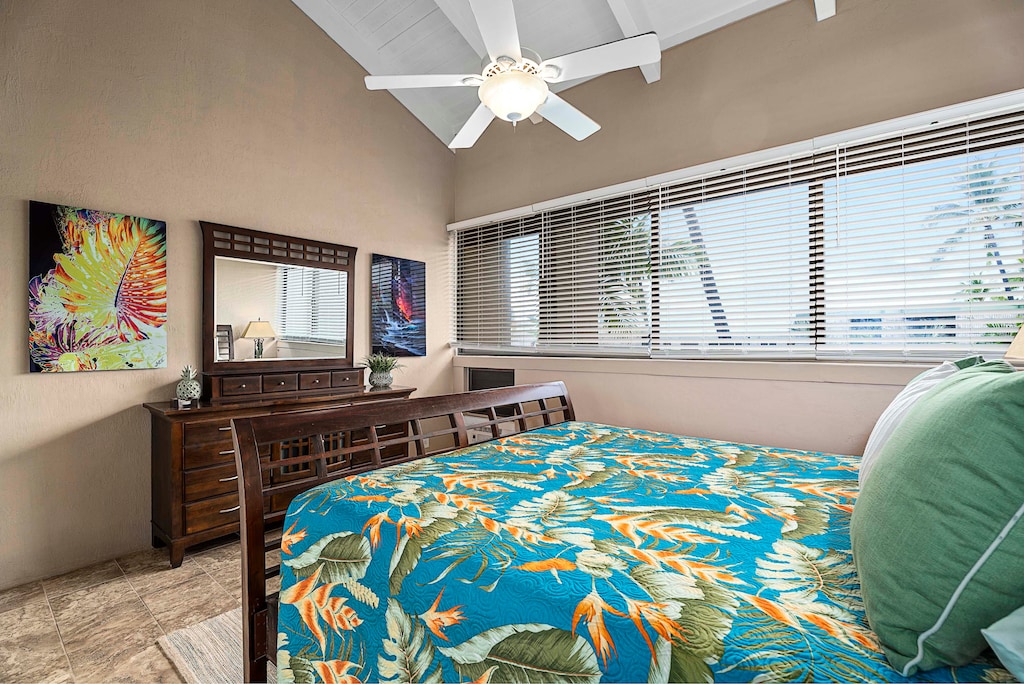 The Primary Bedroom has a king-sized bed, a large dresser and a large window allows you to awake to ocean views and fresh tropical breezes every morning.
