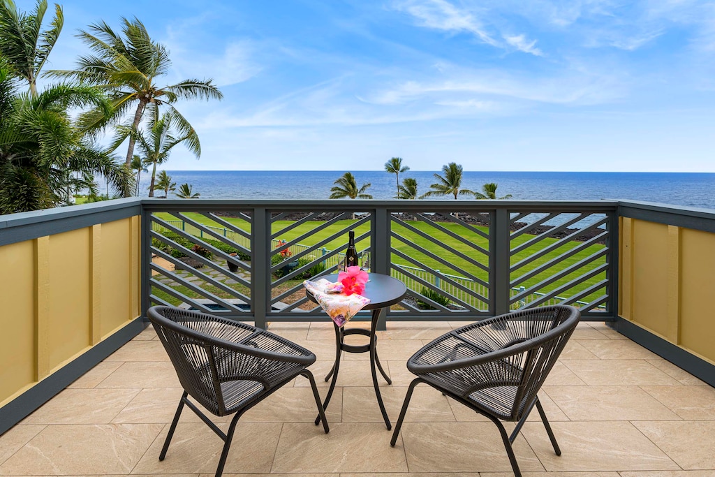 Private lanai off the primary suite with panoramic ocean views