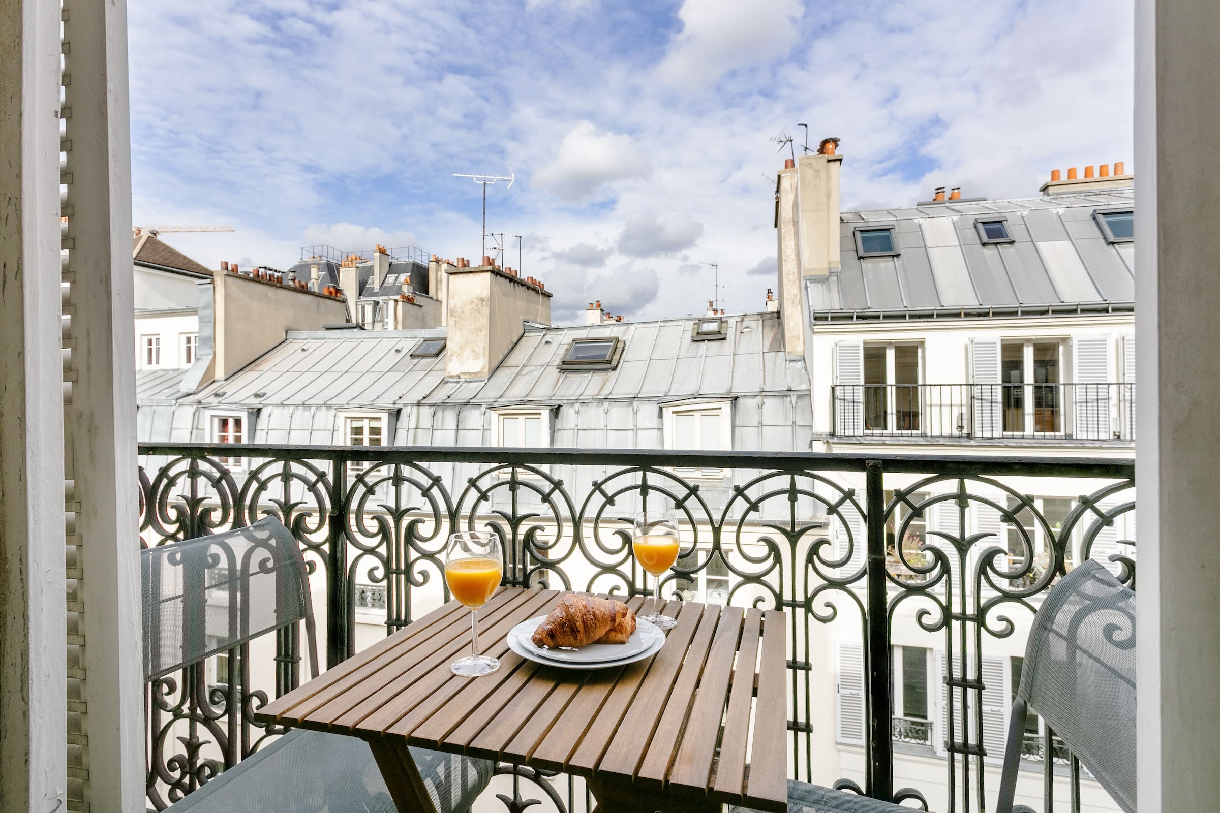 The private balcony with Parisian rooftop views