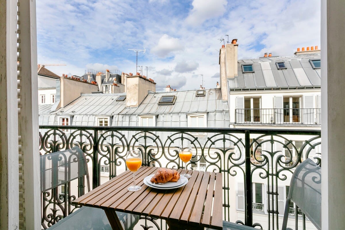 The private balcony with Parisian rooftop views