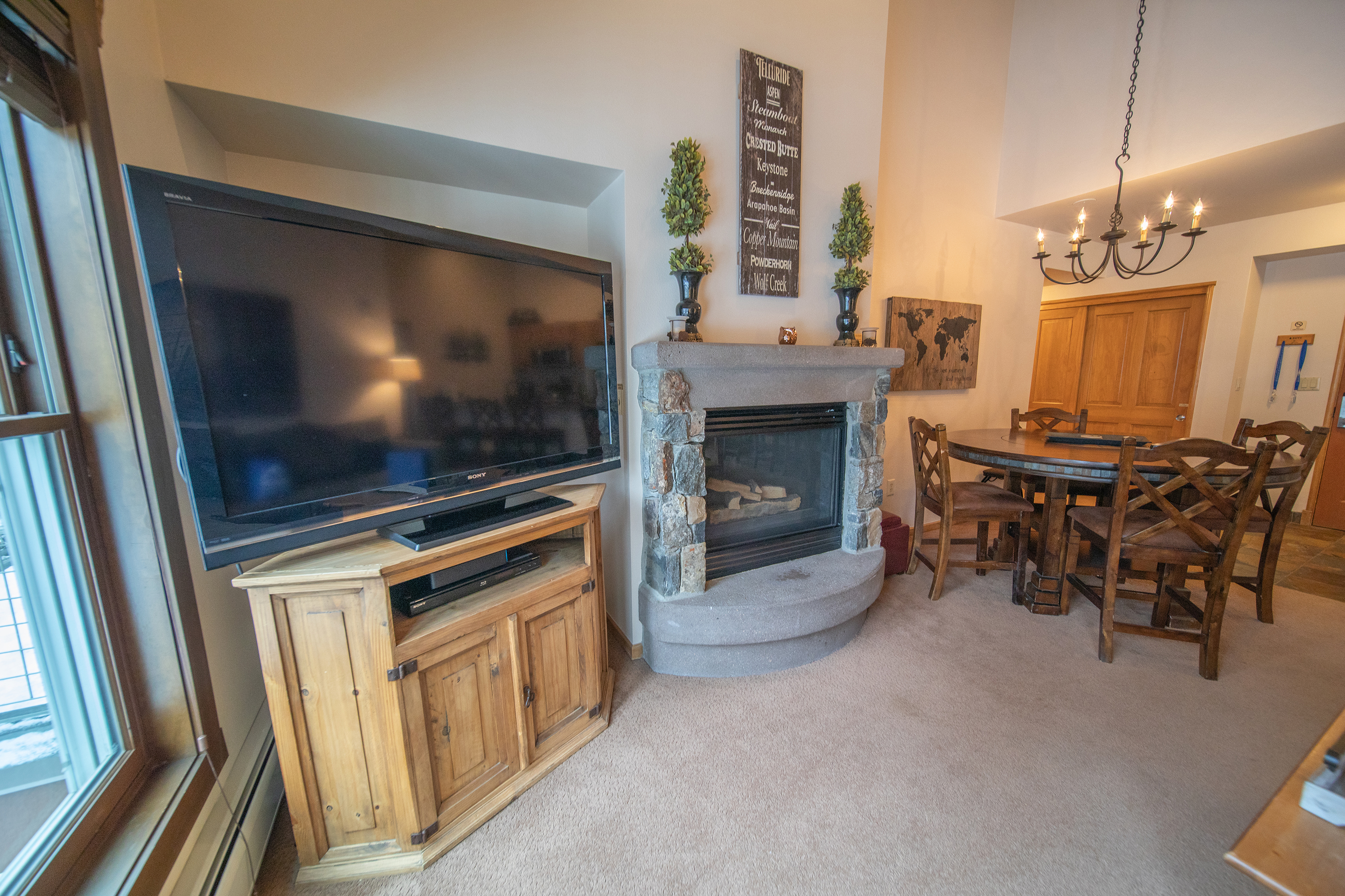 Large flat screen television and a gas fireplace - Perfect for a snowy day in