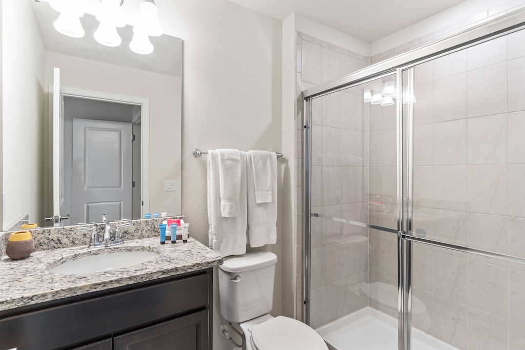Refreshing Escape: Bathroom 3 boasts a spacious walk-in shower, offering a refreshing escape from the day's hustle. A serene oasis where relaxation flows freely, promising rejuvenation with every drop.