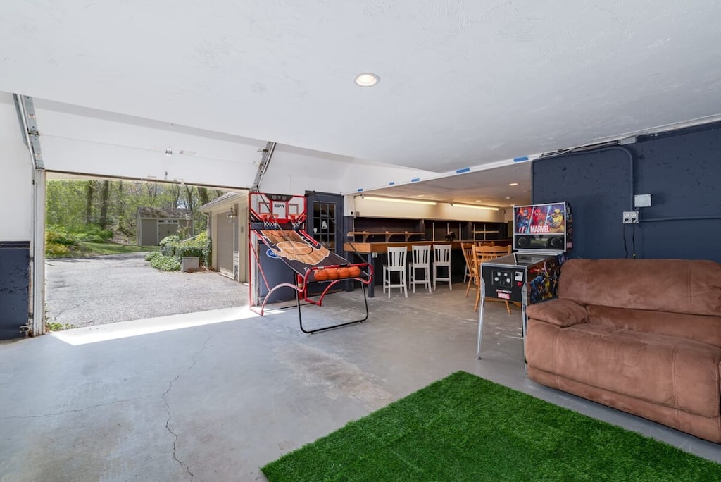 Playtime in the garage game room! Open the doors for a breeze in the summer, or soak in the floor heat in the winter!