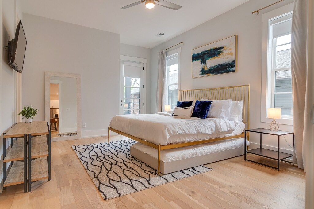 This spacious bedroom has it all - a king bed, an en suite bath and a door to a small, private patio.